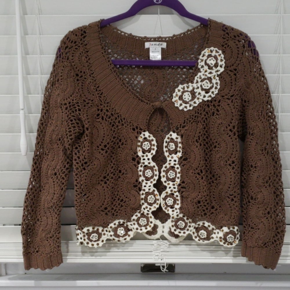 Cropped waist length cardigan crocheted